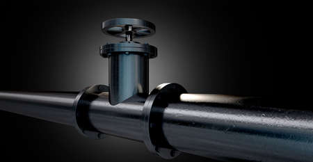 A metal shutoff valve attached to a metal pipe with bolts on an isolated dark backgroundの写真素材