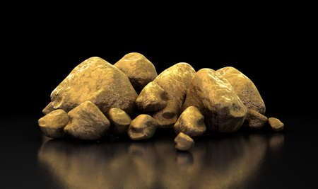 A collection of gold nuggets on an isolated dark backgroundの写真素材