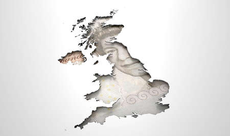 The shape of the country of Great Britain in the colours of its pound currency recessed into an isolated white surfaceの写真素材