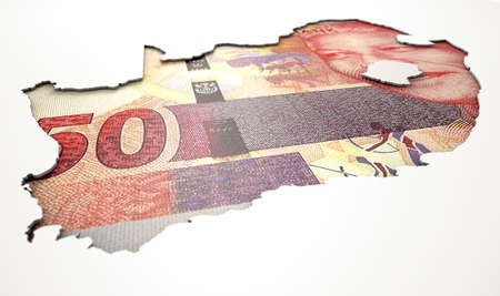The shape of the country of South Africa in the colours of its rand currency recessed into an isolated white surfaceの写真素材