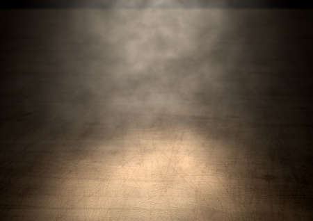 An stage lit by a single spotlight on a dark background