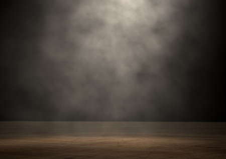 An stage lit by a single spotlight on a dark backgroundの写真素材