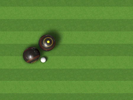 A top view of a set of wooden lawn bowls next to a jack on a perfect flat green lawnの写真素材