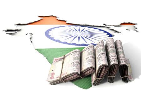 The shape of the country of India in the colours of its national flag recessed into an isolated white surface with a wad of folded indian rupee notes resting on itの写真素材