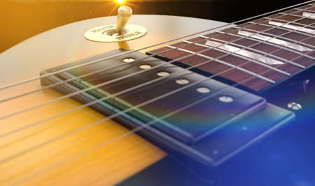 An abstract closeup of the body section of an electric guitar under dramtic lighting conditons