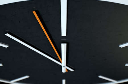 An extreme close up of a modern simplistic watch face on an isolated studio background