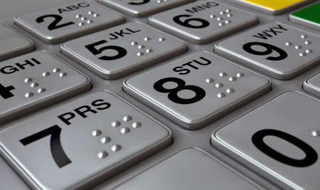 Closeup view of a generic atm keypad buttons with numbers and braille