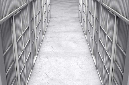 A direct top view of a row of closed jail cells between a concrete aisle lit by a single dramatic...
