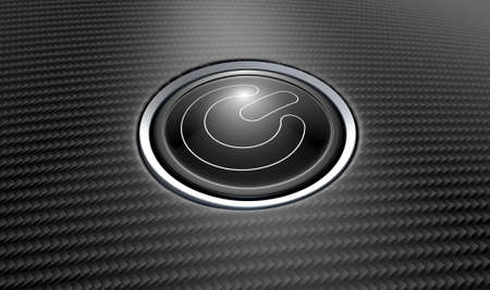 A closeup of a modern power button with white lights on a carbon fiber textured surfaceの写真素材