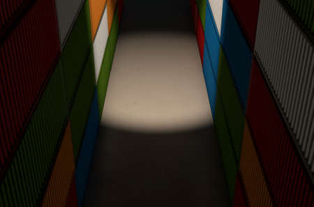 A corridor bewteen two rows of stacked colorful metal freight shipping containers