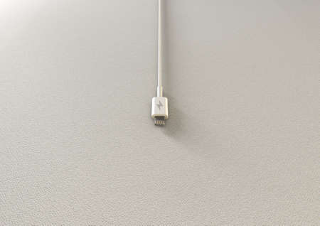 A regular mobile phone charger on an isolated background with copy space
