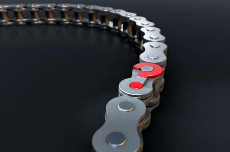 A regular bicycle chain with a question mark as its master link on a dark isolated backgroundの写真素材