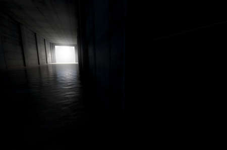 A distant look down a dark stadium sports tunnel to enter a lit arena in the distance