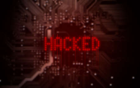 A 3D render of a macro view of a circuit board with red digital text projecting above it saying hacked on a dark backgroundの写真素材