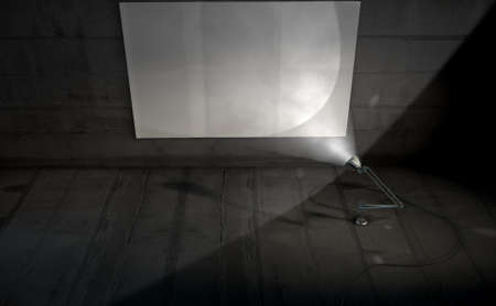 A 3D render of a vintage desk lamp illuminating a blank poster on a dark blank wall backgroundの写真素材