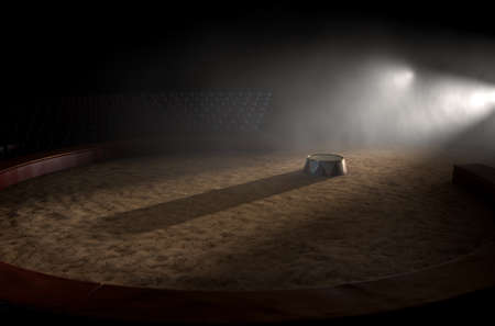 A 3D render of a classic circus arena and an empty ringmasters podium backlit by dramatic spot lights on a dark moody backgroundの写真素材