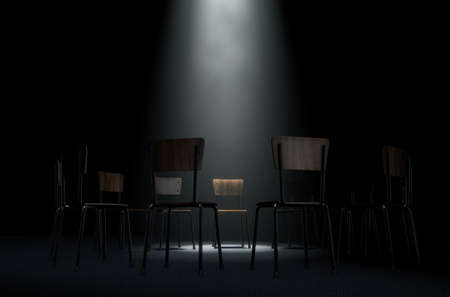 A 3D render concept of a group of chairs in a circular formation with one chair highlighted by a single moody spotlight on a dark backgroundの写真素材
