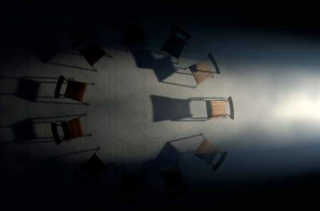 A 3D render concept of a group of chairs in a circular formation with one chair highlighted by a single moody spotlight on a dark backgroundの写真素材