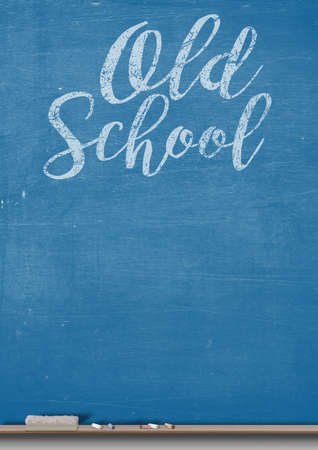 A 3D render of a rectangular blue chalkboard with a wooden ledge chalk and a duster with the words old school written on itの写真素材