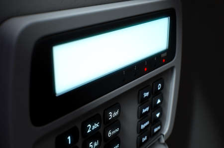 A 3D render of a home security keypad access panel with buttons and a blank illuminated screen...