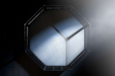 A 3D render of an MMA fight cage arena dressed in black padding spotlit by a single light on an...