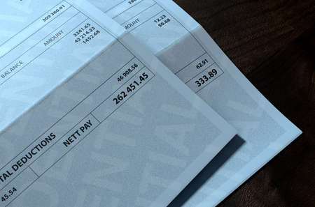A 3D render concept showing two fictitious paychecks with a huge difference in the nett pay...