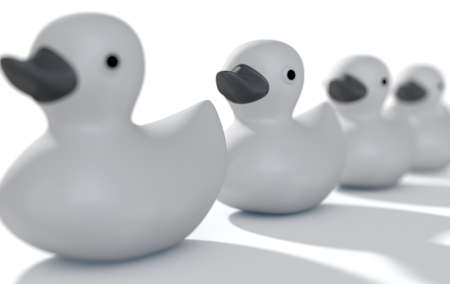 A row of organised and ready grey rubber bath duck toys on an isolated background - 3D renderの写真素材