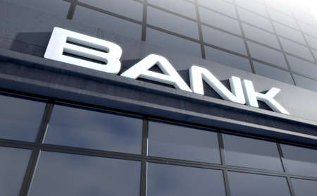 Banking light box signage above the entrance to a modern glass bank building in the day time - 3D renderの写真素材