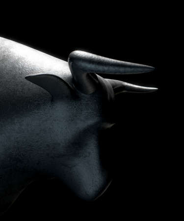 A closeup of a metal casting depicting a stylized bull in dramatic light representing financial market trends on an isolated dark background - 3D renderの写真素材