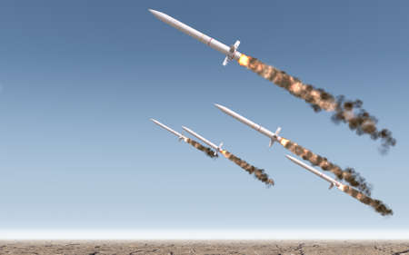 A row of intercontinental ballistic missiles launching in a desert on a blue sky backgrund - 3D...