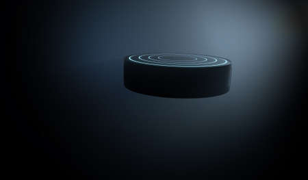 A futuristic sports concept of a black textured hockey puck lit with neon markings flying through dark space - 3D renderの写真素材