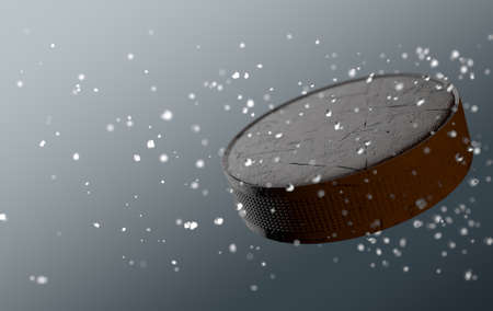A scratched hockey puck caught in slow motion flying through the air scattering water and ice particles in its wake - 3D renderの写真素材