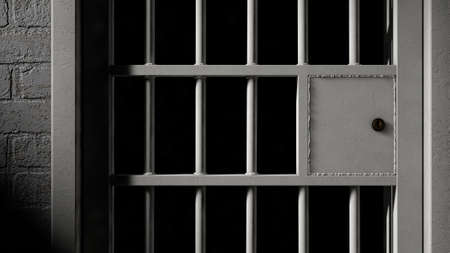 A closeup of the locking mechanism of a closed jail cell with welded iron bars on a dimly lit dark...