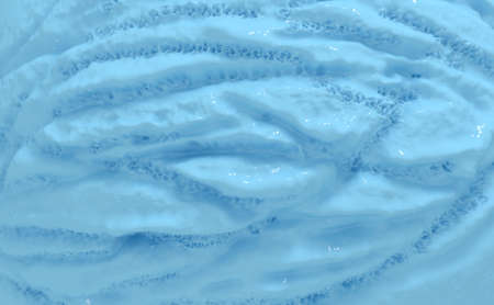 A closeup of a scoop of a creamy ball of blue ice-cream on an isolated background - 3D renderの写真素材