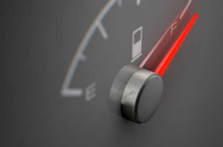 A closeup of a petrol gas gage showing the needle at full on a dark reflective background with copy...