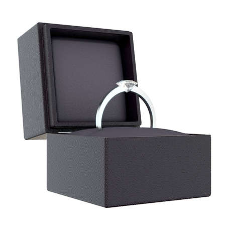 An open cube shaped black ring box with a silver engagement ring and large cut diamond on an...