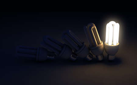 A row of toppling fluorescent light bulbs in sequence with a single one illuminated - 3D renderの写真素材