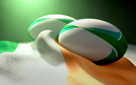 Two regular rugby balls with color design elements resting on a draped ireland flag on an isolated dark studio background - 3D renderの写真素材