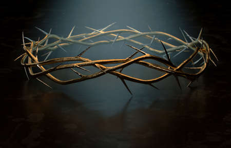 Branches of thorns woven into a gold crown depicting the crucifixion on a dark spotlit background - 3D renderの写真素材