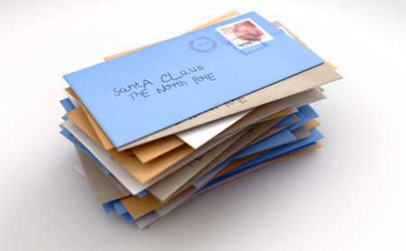 A stack of childrens wish list letters addressed to santa clause in the north pole on an isolated...