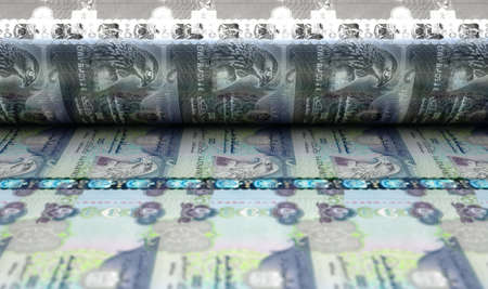 A concept image showing a sheet of Dubai Dirham notes going through a print roller in its final...
