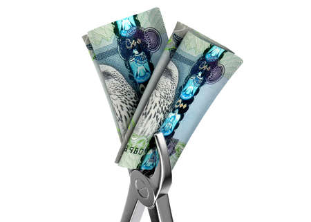 A pair of medical pliers gripping a rolled up pair of russian ruble bank notes on an isolated white...