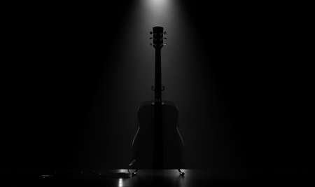 A silhouette of an acoustic guitar resting on a stand on a music concert stage lit by a single dramatic spotlight - 3D renderの写真素材