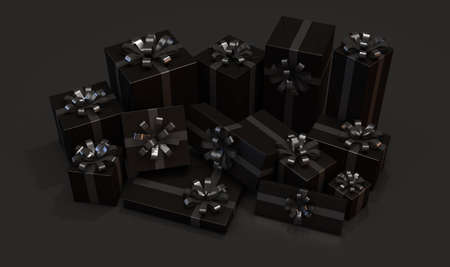 A collection of different sized gift boxes wrapped in black paper with a black ribbon and bow on an...