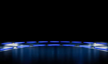 A black reflective stage setting with silver designs lit by a circular arrangement of blue neon...