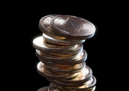 A crumbling and falling stack of gold physical ethereum coins on a dark background - 3D renderの写真素材