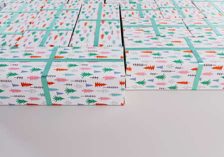 A collection of different sized rectangular gift boxes wrapped in christmas tree gift wrap paper...