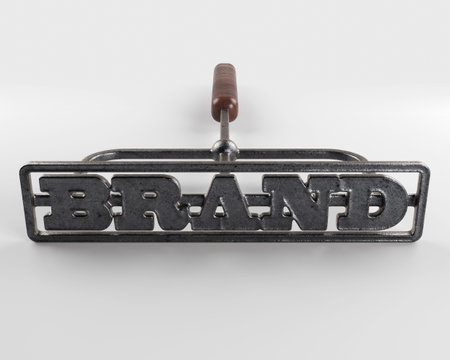 A metal cattle branding iron with the word brand as the marking area on an isolated white surface - 3D renderの写真素材