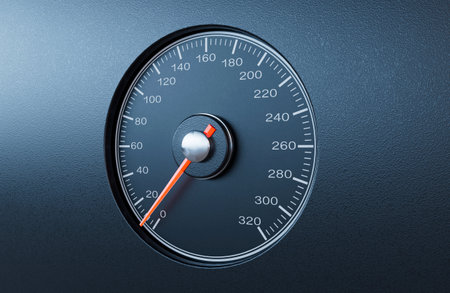 A regular car speedometer with an orange needle pointing towards a slow speed on an isolated black...
