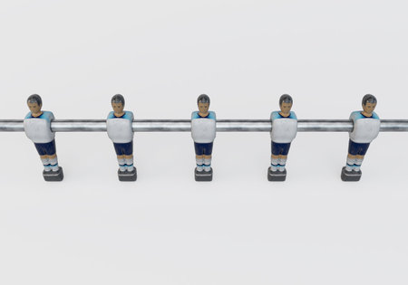A single line of worn figurines from a vintage foosball or table football table styled in kit resembling the England national team - 3D renderの写真素材